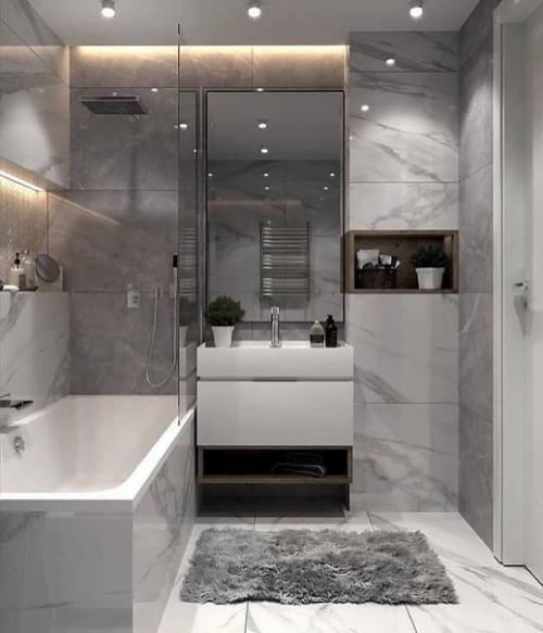 Просторная ванная комната, оформленная в современном стиле.