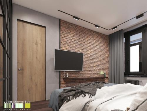Интерьер спальни выполнен в современном направлении с элементами стиля лофт. 02