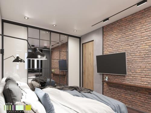 Интерьер спальни выполнен в современном направлении с элементами стиля лофт.