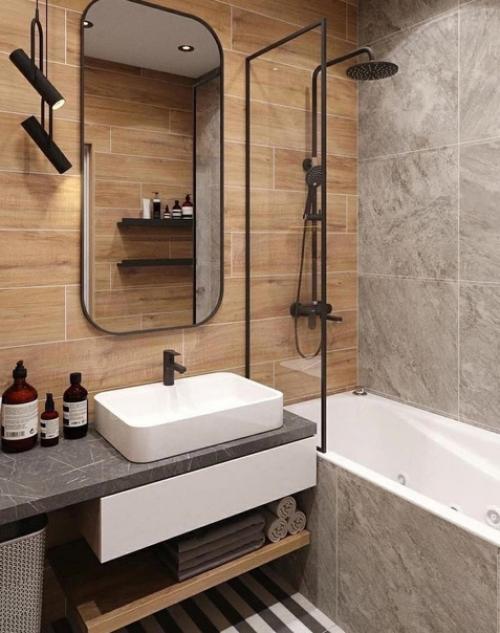 Лишь в том случае, если посмотреть с одной стороны, то очень простая ванная комната, но так же само очень стильная и современная! 04